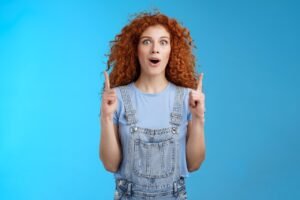 girl, woman, female, ginger, red, nature, redhead, aspiration, up, summer, pointing, indicating, direction, promo, lucky, hairstyle, haircut, curly, foxy, girlfriend, student, employee, enthusiastic, excitement, fashion, advertisement